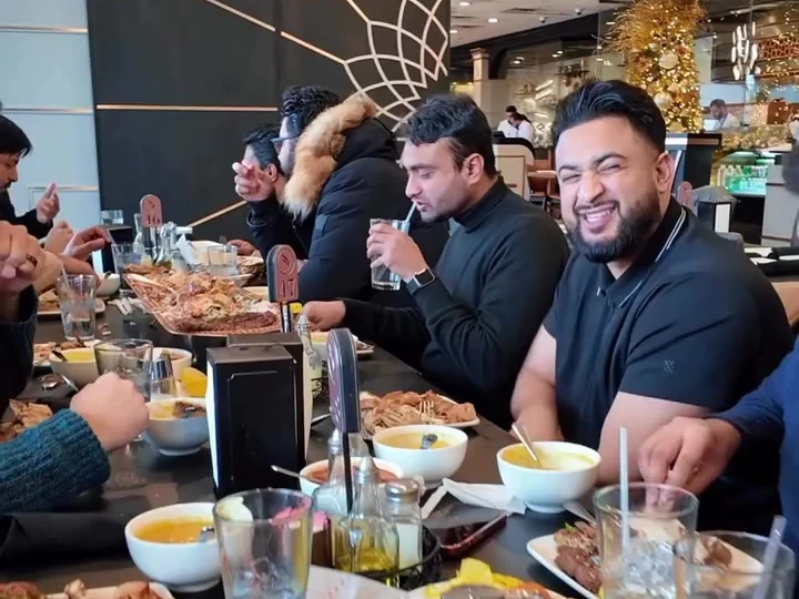 A group sharing lunch around a restaurant table during the tour.